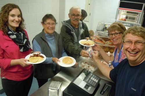 L-r Elizabeth Conbery, Joan and Rudy Hollywood are served up a pancake breakfast courtesy of Anne Howes and Randy McVety at GREC's annual United Way breakfast fundraiser on Oct. 21. Not in the photo but also helping out in the kitchen was Amy McDonald.